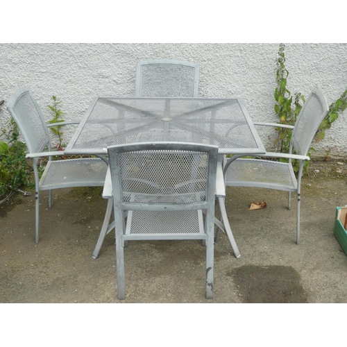 526 - A metal garden table and four chair set.