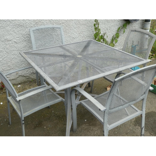 526 - A metal garden table and four chair set.