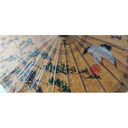 209 - A decorative hand painted Oriental parasol.