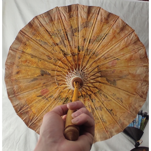 209 - A decorative hand painted Oriental parasol.