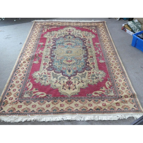 216 - A large antique/ vintage decorative rug, measuring 182X268cm.