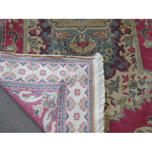 216 - A large antique/ vintage decorative rug, measuring 182X268cm.