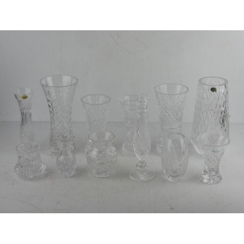 61 - A large lot of assorted crystal vases to include Tyrone and Galway crystal.