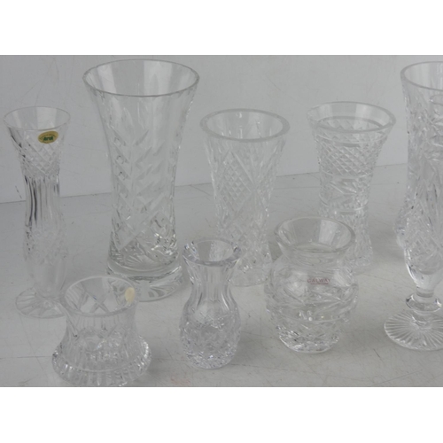 61 - A large lot of assorted crystal vases to include Tyrone and Galway crystal.