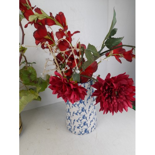 191 - A collection of ceramic potted flower arrangements and more.