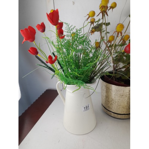 191 - A collection of ceramic potted flower arrangements and more.