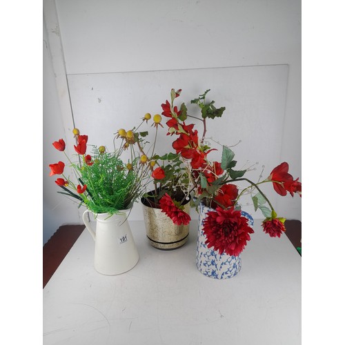 191 - A collection of ceramic potted flower arrangements and more.