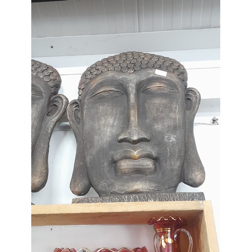 76B - A  large Buddha head. 57x44cm.