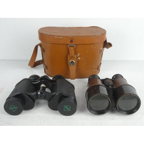 21 - A vintage leather cased Treenkat 8 x 30 field glasses and antique pair of French binoculars.