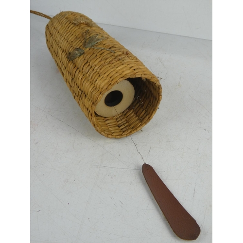 24 - A vintage rattan covered wind chime.