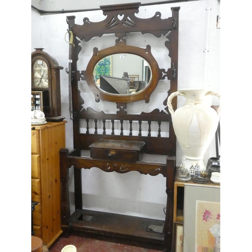 25 - A stunning antique mahogany mirror back hall stand with original scroll hooks (one missing).