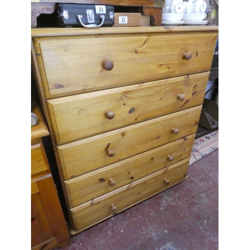 30 - A modern pine chest of five drawers.