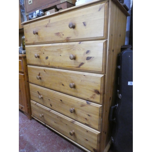 30 - A modern pine chest of five drawers.