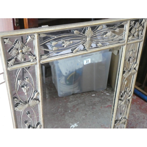 31 - A large stunning decorative metal framed wall mirror, 110cm x 80cm.