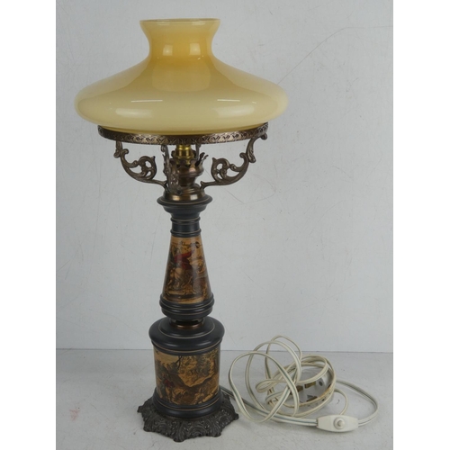 35 - A stunning vintage wrought iron based table lamp with decorative panels and glass shade.