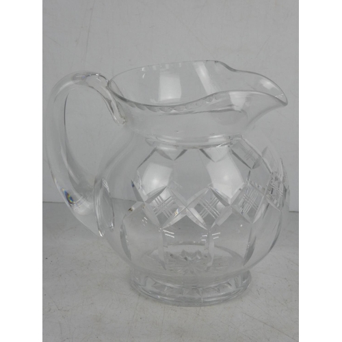 44 - A vintage cut glass water jug.