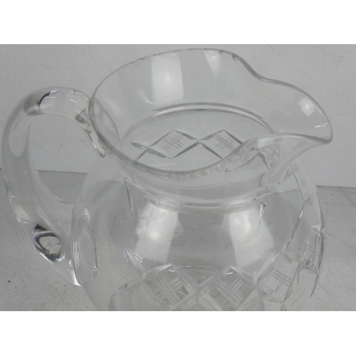 44 - A vintage cut glass water jug.