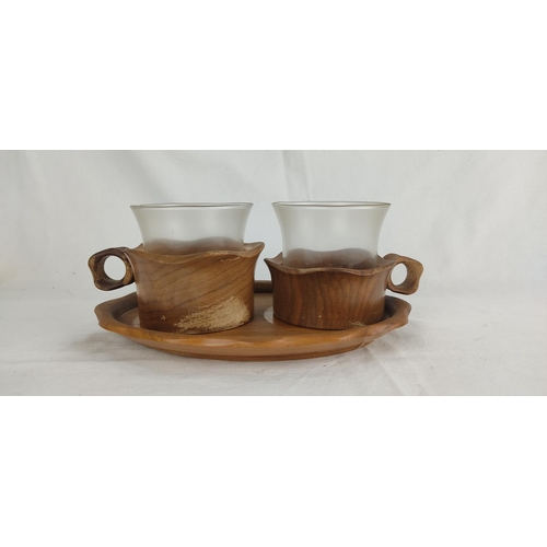 102 - A vintage glass set with wooden cup holders and tray.