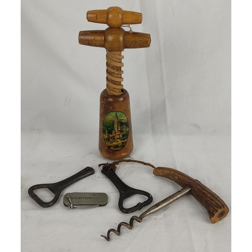 104 - A collection of vintage corkscrews to include Guinness, Crown Cork and more.