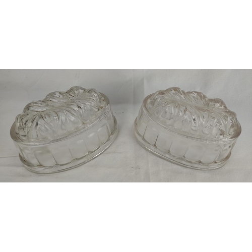 111 - A pair of antique glass jelly moulds.