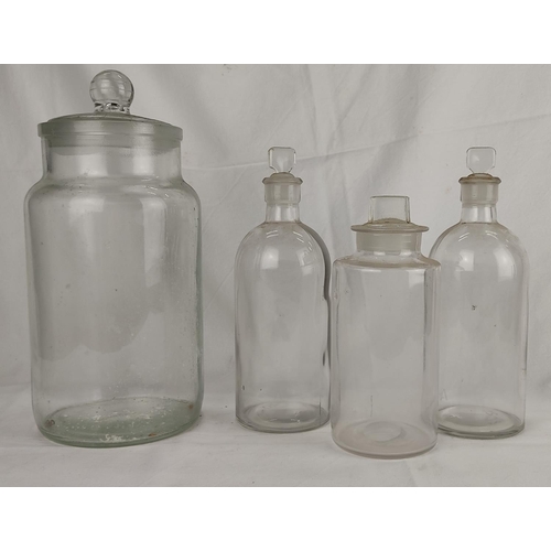 116 - Four vintage clear glass chemist bottles.