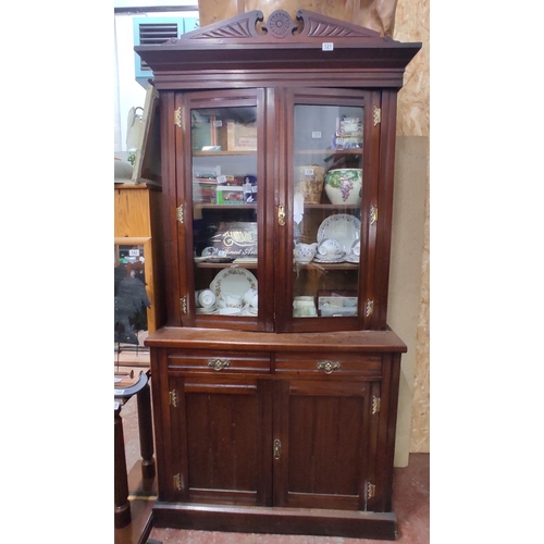 121 - A stunning antique mahogany two door bookcase with detailed brass brackets, 214cm x 105cm x 42cm.
