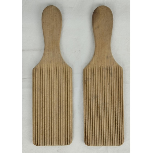 131 - A pair of vintage wooden butter pats.