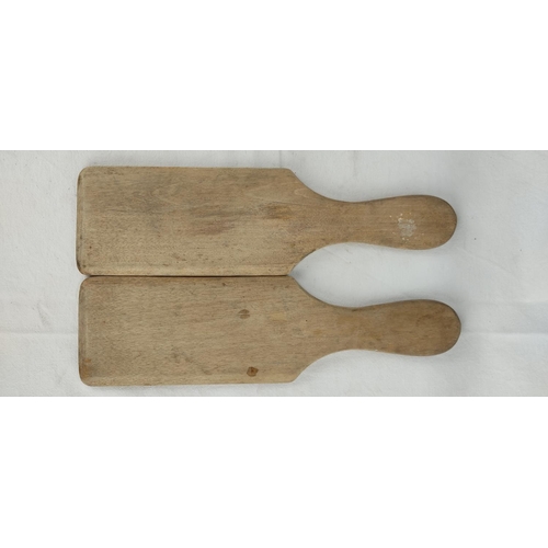 131 - A pair of vintage wooden butter pats.