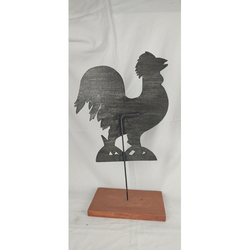 141 - A metal cockerel mounted on a wooden plinth, 47cm.