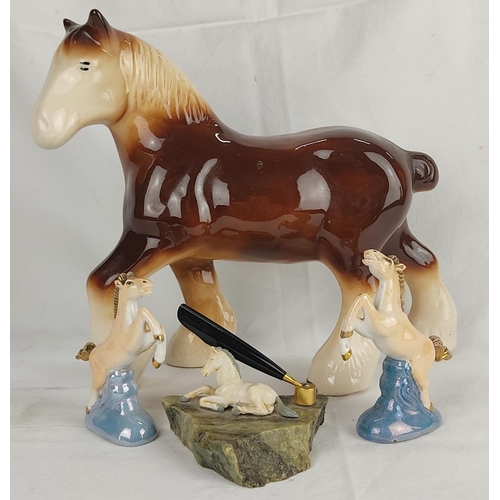 154 - A ceramic shire horse, a Connemara marble pen holder and a pair of horse ornaments.