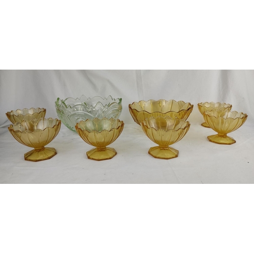 178 - A vintage amber glass pudding set and another pressed glass bowl.