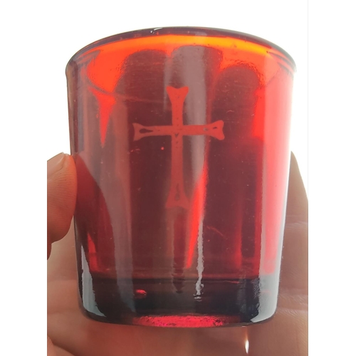 187 - An unusual vintage red glass prayer candle holder on a metal stand, produced by F T & Co Ltd, London