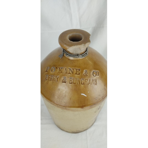 189 - An antique flagon 'P O'Kane & Co, Derry & Buncrana' (a/f), 33cm.