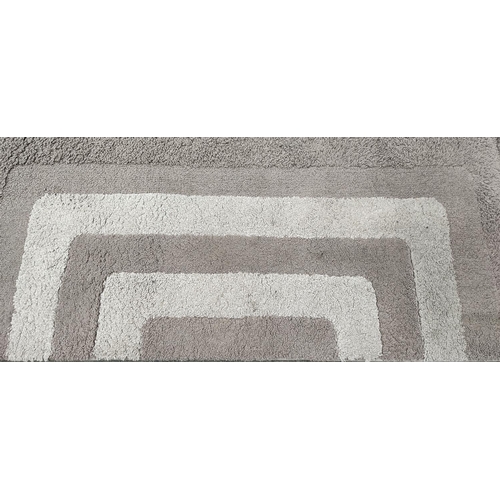 64 - A vintage wool rug, 200cm x 136cm.