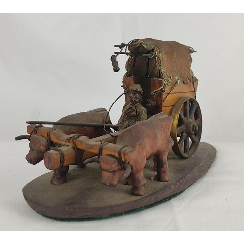 73 - A vintage hand carved wooden sculpture of Oxen and cart.