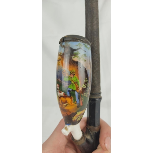 90 - An antique Bavaria, German hand painted porcelain pipe 'The Poacher'.