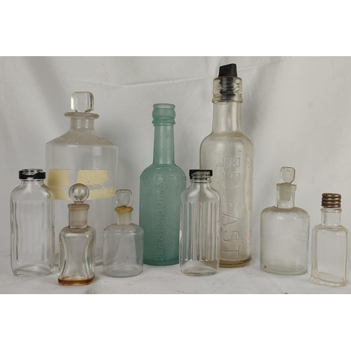 91 - A collection of antique glass bottles.