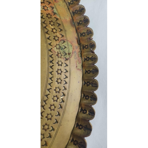 94 - An antique brass tray/charger, 40cm diameter.