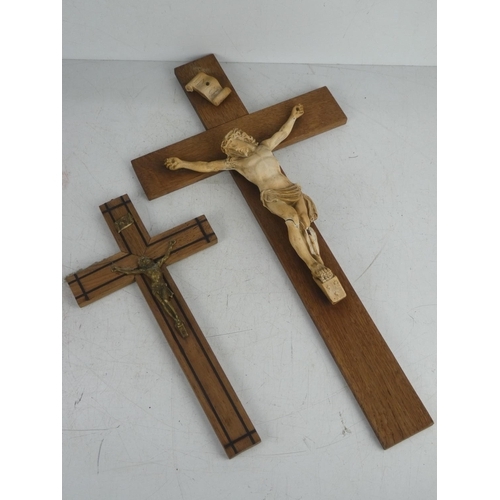 20 - Two vintage wall mounted crucifixes.