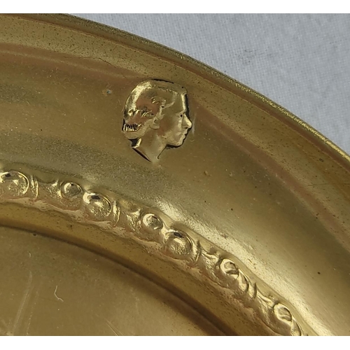 210 - A vintage brass tray, a wooden handled bell and another.