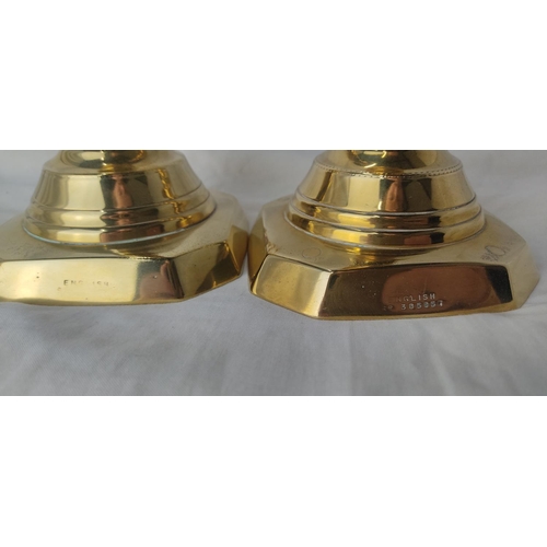 220 - A pair of antique brass 'King of Diamond' pattern candlesticks, English made, 30cm.