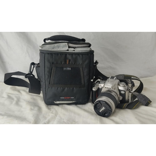 283 - A Nikon camera and bag.