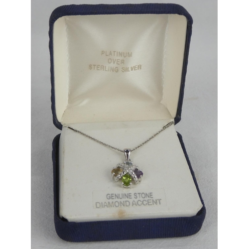 329 - A decorative boxed Platinum over Sterling Silver pendant & chain.