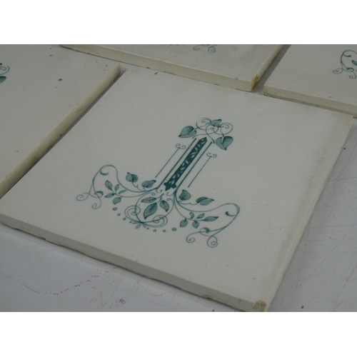 375 - A collection of 8 antique/ Art Nouveau tiles.