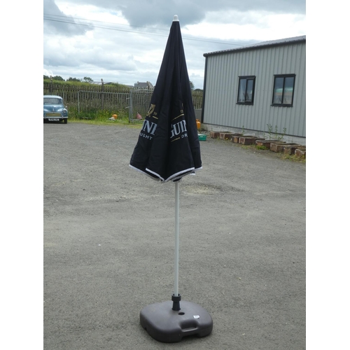 480 - A Guinness parasol and weighted base.