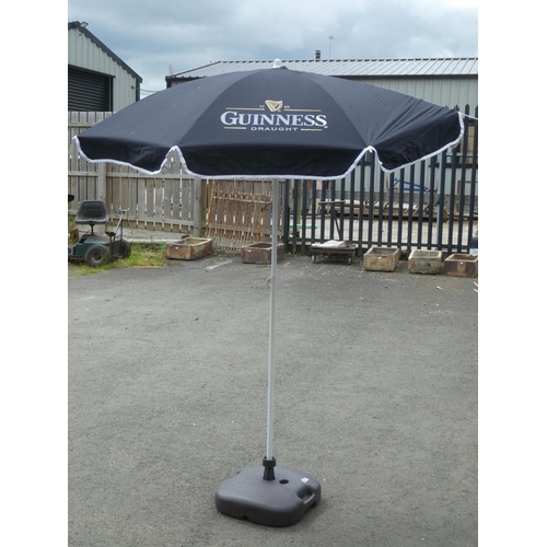 480 - A Guinness parasol and weighted base.