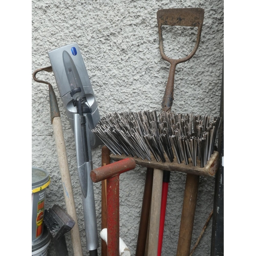 494 - A lot of assorted garden tools, yard brushes etc.