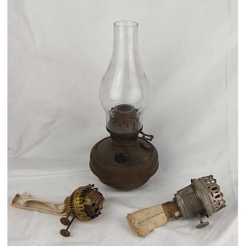 407 - An antique brass oil lamp and two extra oil lamp burners.