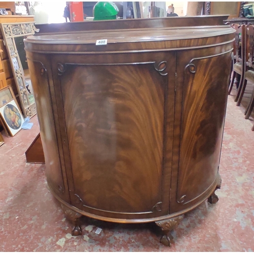 408 - A stunning antique mahogany demi lune cabinet on ball and claw feet and gallery back, measuring 105c... 