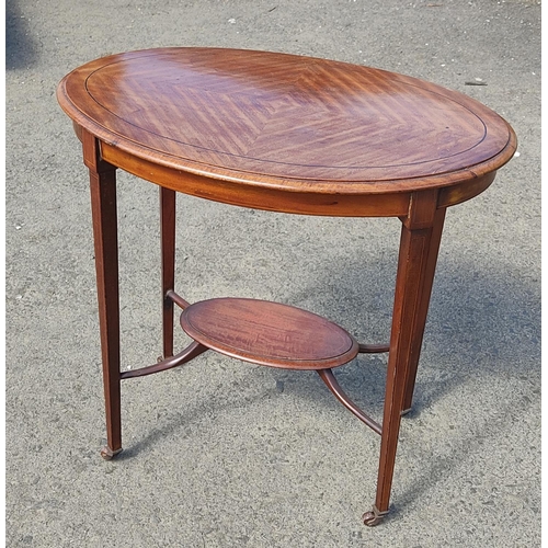 411 - A stunning antique inlaid oval occasional table with undershelf, 70cm x 75cm x 47cm.